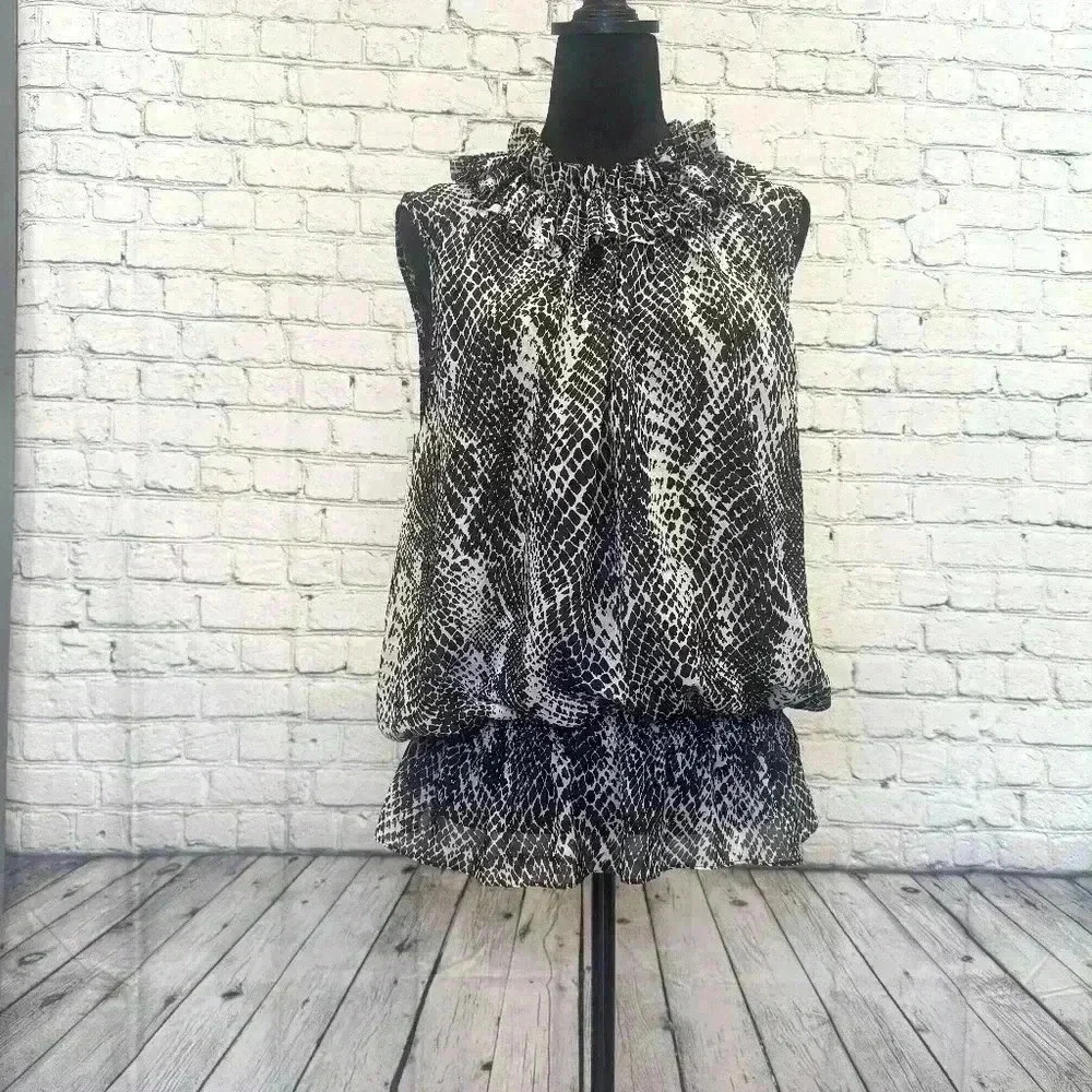 RUFFLED BROWN AND CREAM ANIMAL PRINT BLOUSE SIZE 12



A5